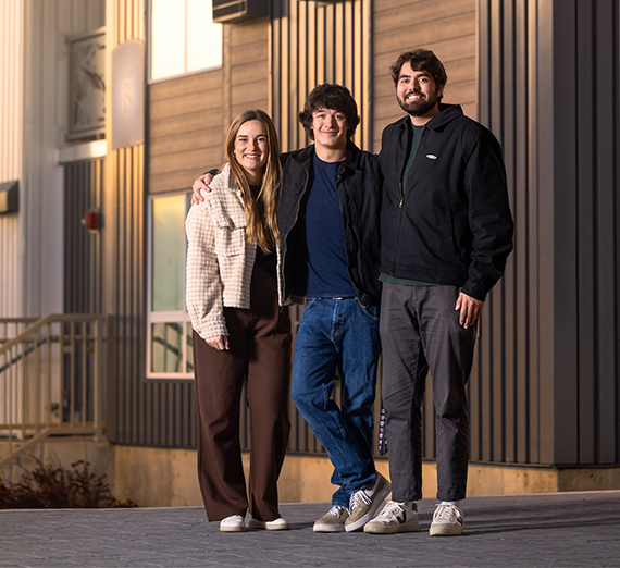 female dressed in kennel club attire dances in front of Kennel doors